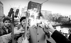 Salman Rushdies Satanic Verses is burned by Muslims in Bradford, 1989.